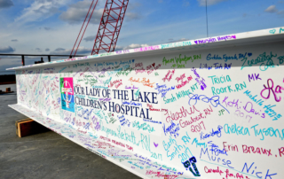 Exterior Image of Children's Hospital Opening With Colorful Signed Wall