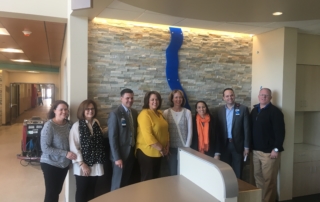 Group photo of the ADAMS Team touring the Shawnee Mission Health B.E. Smith Family Center
